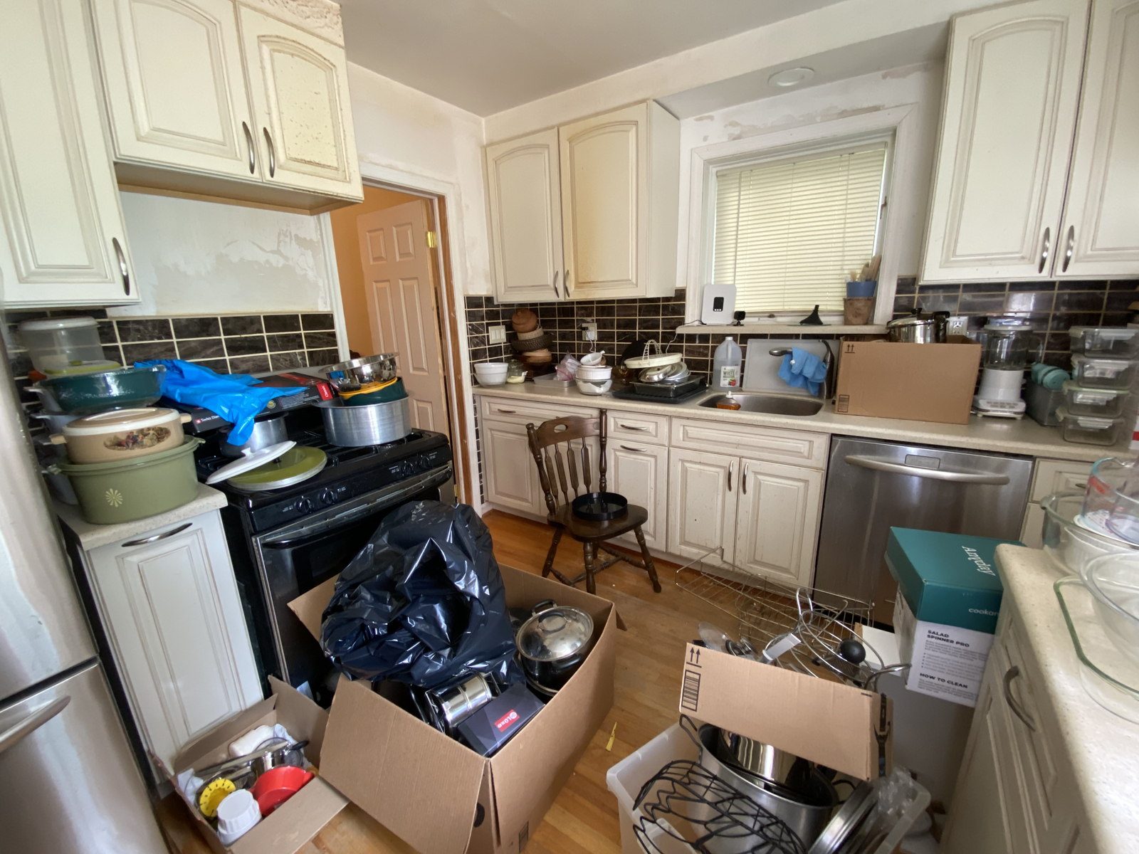 Cluttered Kitchen with Cookware and Appliances